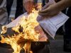 Italians burn energy bills in protest over soaring costs