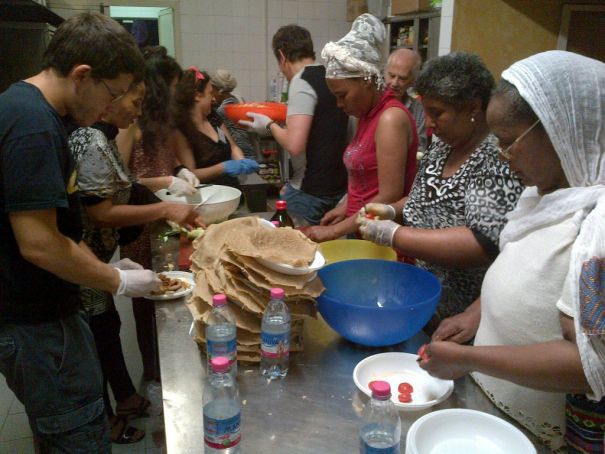 Volunteers preparing lunch in the kitchens at the Baobab Centre.