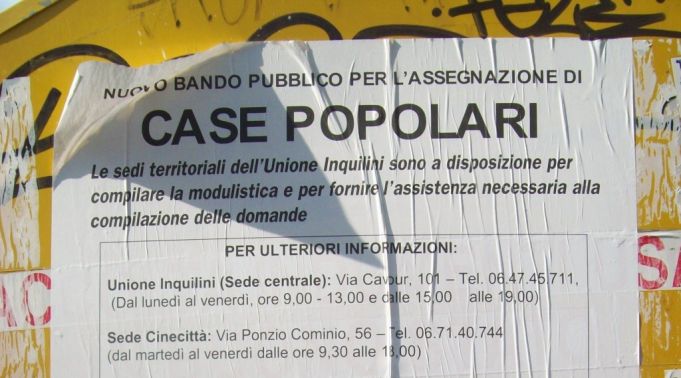Poster in front of council houses in Largo Corrado Ricci.