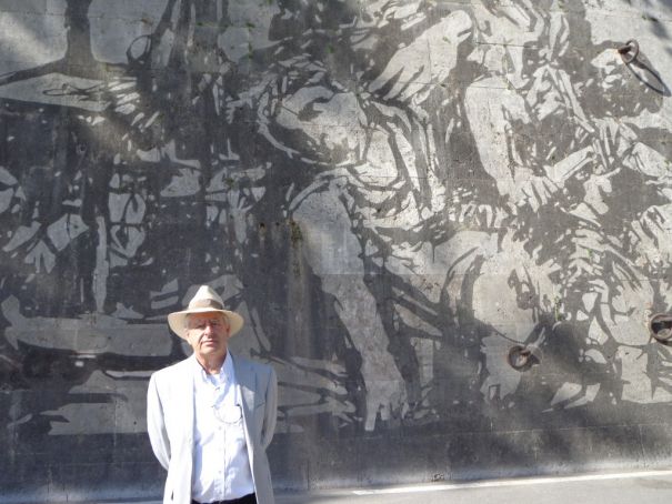 Kentridge in front of Triumphs and Laments.