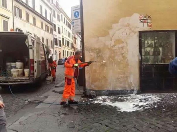 AMA Roma workers remove Maupal mural.