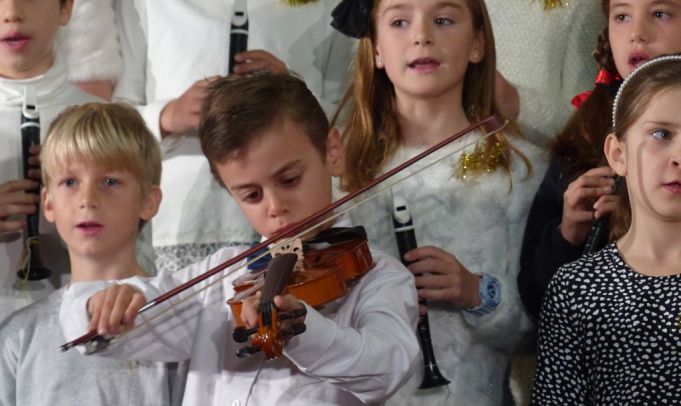 Jonah Giuliani plays violin for Ambrit's Winter Recital.