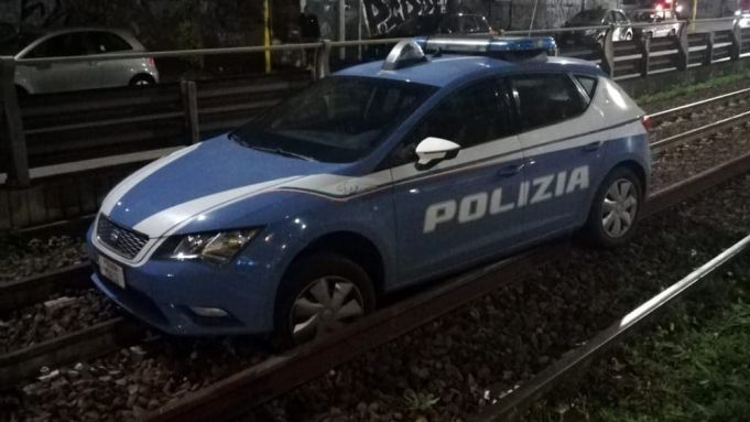 Rome police car stuck on train tracks