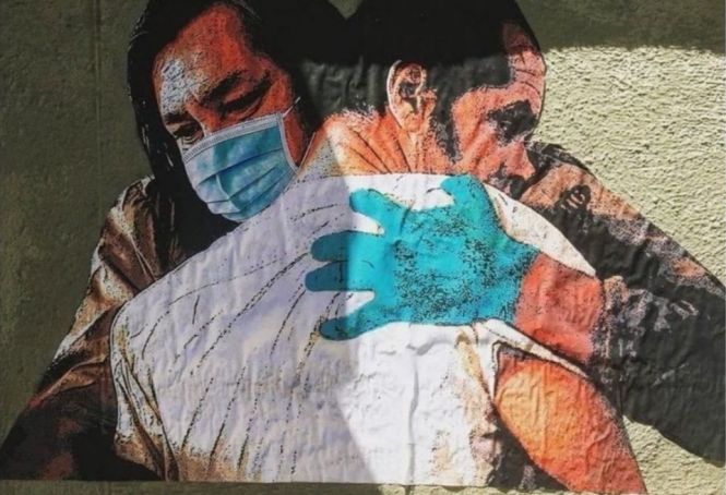Rome street artist's Hug mural for Spallanzani