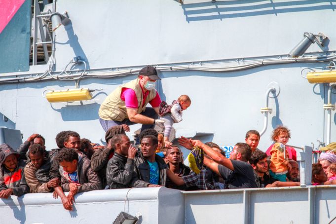 North African migrants refugees on a ship in the port of Taranto, Puglia, Italy