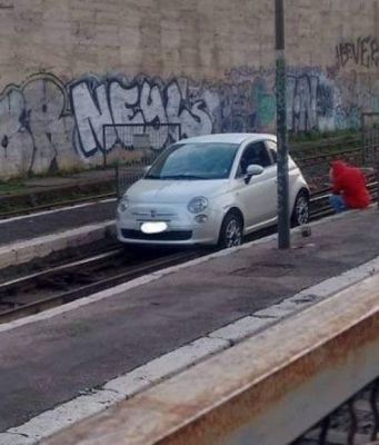 Car stuck on train tracks at Rome's Termini station