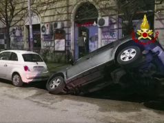 Rome sinkhole swallows two cars