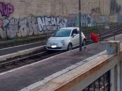 Car stuck on train tracks at Rome's Termini station