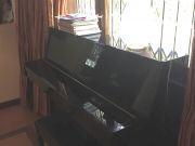 Piano, black upright Yamaha