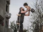 Italy gives refuge to Syrian father and limbless son in famed photo