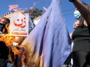 Mahsa Amini: Women cut hair and burn hijabs outside Iran embassy in Italy